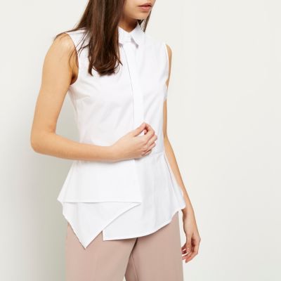 White sleeveless peplum shirt